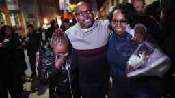 Mary Stewart, left, walks with her son, Andrew Stewart and her daughter, Ulonda Stewart, after his release.