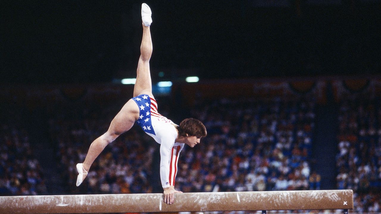 Los Angeles, CA - 1984: Mary Lou Retton, Women's Gymnastics balance beam competition, Pauley Pavilion, at the 1984 Summer Olympics, August 1, 1984. (Photo by Ken Regan /Disney General Entertainment Content via Getty Images)