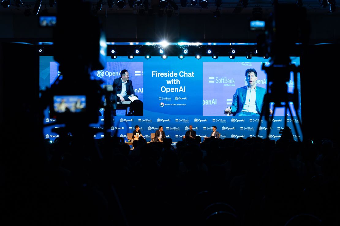 Kyunghyun Cho, professor of computer science and data science at New York University, from left, JP Lee, chief executive officer of Softbank Ventures Asia, Greg Brockman, president and co-founder of OpenAI, and Sam Altman, chief executive officer of OpenAI, during a fireside chat organized by Softbank Ventures Asia in Seoul, South Korea, on Friday, June 9, 2023. OpenAI is focused on building a better, faster and cheaper model of its generative AI ChatGPT product, Altman has said previously. The product made AI a buzzword and kicked off a global race among tech companies to build their own versions of the chatbot technology.