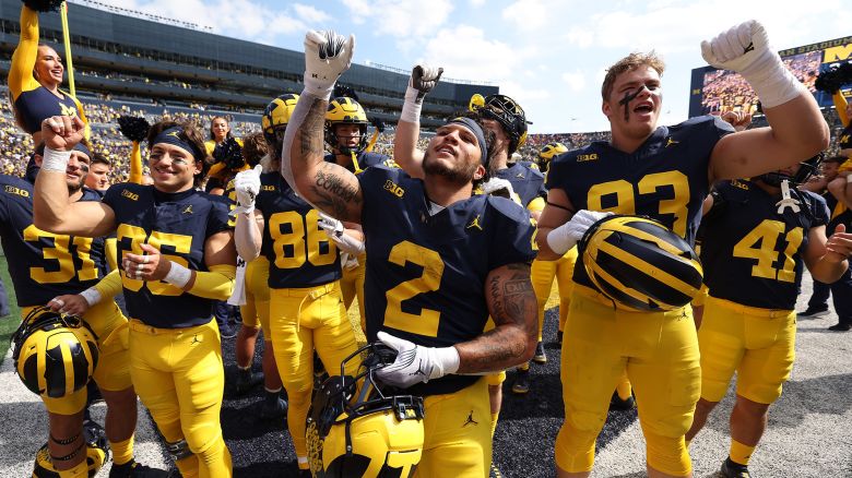 ANN ARBOR, MICHIGAN - SEPTEMBER 23: Blake Corum #2 of the Michigan Wolverines celebrates a 31-7 win over the Rutgers Scarlet Knights with teammates at Michigan Stadium on September 23, 2023 in Ann Arbor, Michigan. (Photo by Gregory Shamus/Getty Images)