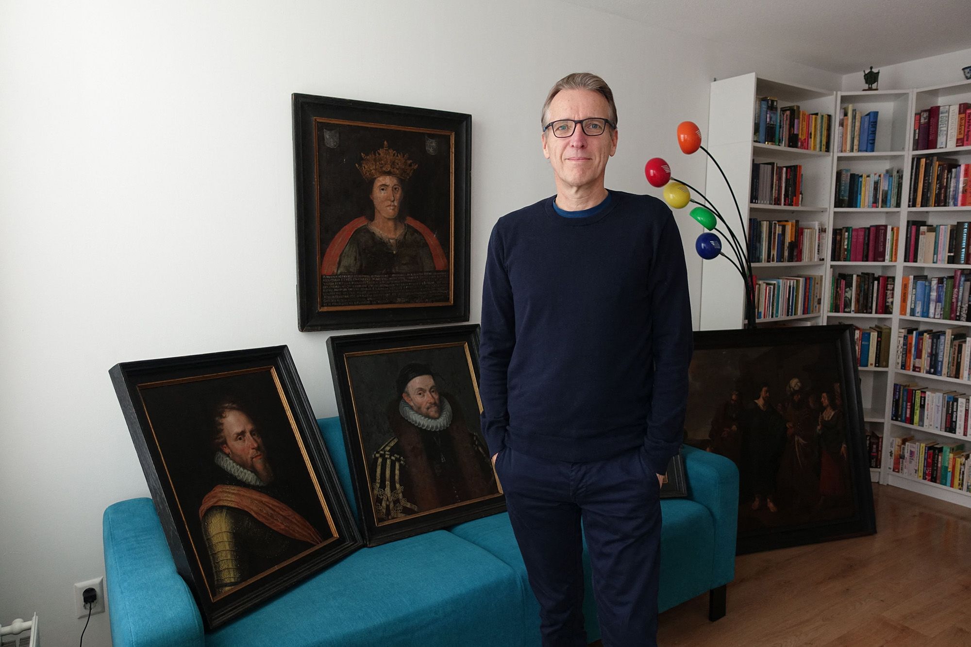 This recent handout photograph obtained courtesy of Arthur Brand shows Dutch art detective Arthur Brand, dubbed the "Indiana Jones of the Art World", posing next to six paintings he has recovered, including a portrait of William of Orange and the first depiction of a seventh-century king. Art sleuth Arthur Brand made headlines around the world last month when he recovered a stolen Van Gogh stuffed in an Ikea bag, and he believes that widely publicised success is leading to more discoveries. (Photo by courtesy of Arthur Brand / AFP) / RESTRICTED TO EDITORIAL USE - MANDATORY CREDIT "AFP PHOTO / Arthur Brand " - NO MARKETING NO ADVERTISING CAMPAIGNS - DISTRIBUTED AS A SERVICE TO CLIENTS (Photo by -/courtesy of Arthur Brand/AFP via Getty Images)