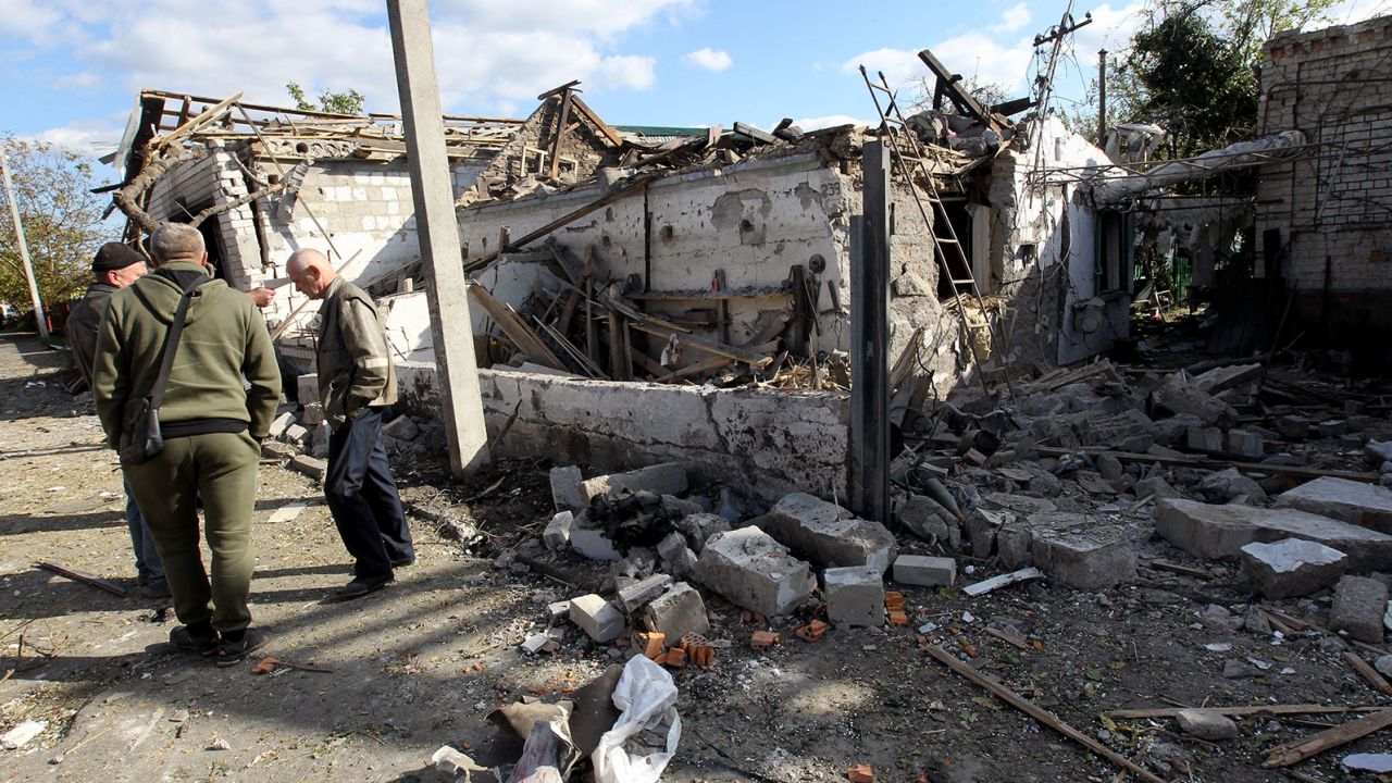 DNIPRO, UKRAINE - OCTOBER 18, 2023 - Men stay outside a house destroyed in the Russian rocket attack that took place Wednesday morning, October 18, Obukhivka, Dnipropetrovsk Region, central Ukraine. The enemy missile killed a 31-year-old woman, the mother of two girls. In addition, four people were injured. Three of them were rushed to the hospital in moderate condition. The rocket destroyed one private house and an outbuilding. In total, 21 private houses, 11 outbuildings, a car and a low-pressure gas pipeline were damaged. (Photo by Mykola Miakshykov/Ukrinform/Sipa USA)