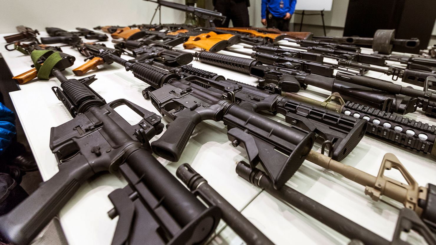 A variety of military-style semi-automatic rifles obtained during a buy-back program are displayed at Los Angeles police headquarters.