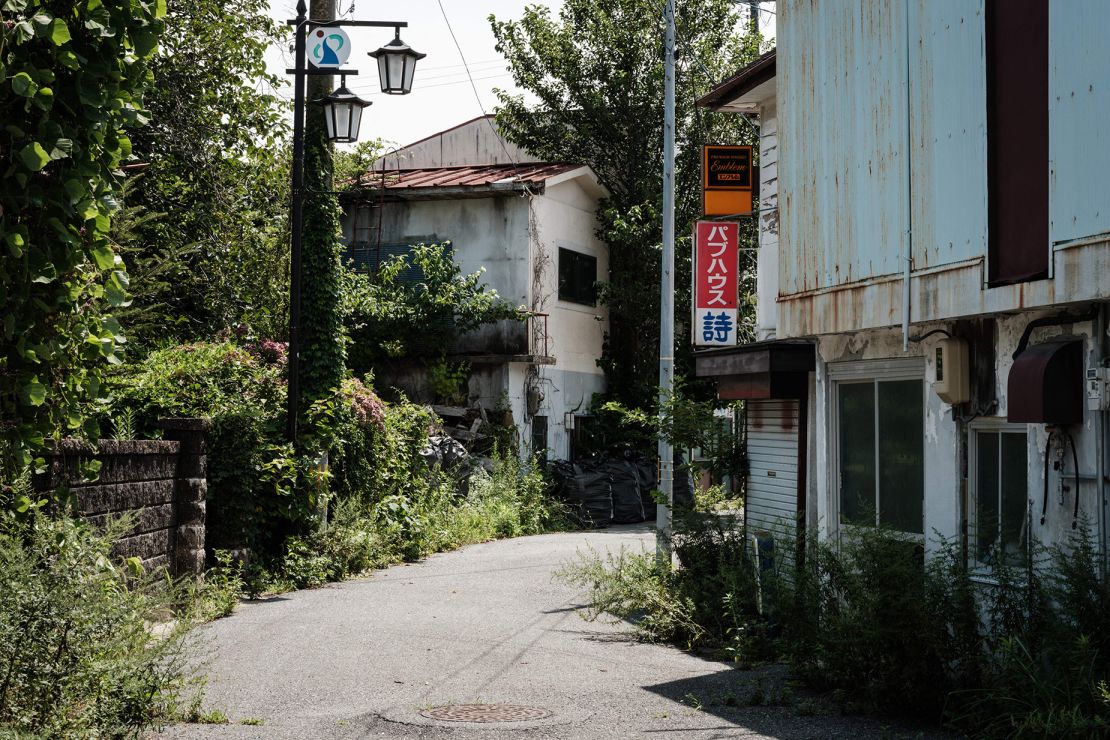 This photo taken on August 2, 2021 shows houses abandoned after the 2011 earthquake and tsunami, inside the exclusion zone where residents are allowed to enter for 30 days per year in Okuma, Fukushima. (Photo by Yasuyoshi CHIBA / AFP) (Photo by YASUYOSHI CHIBA/AFP via Getty Images)