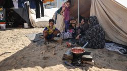 KHAN YUNIS, GAZA - OCTOBER 19: People live in tents at a camp set up by the United Nations Relief and Works Agency for Palestine Refugees (UNRWA) for Palestinians who fled to the southern Gaza Strip, during the thirteenth day of Israeli airstrikes in Khan Yunis, Gaza on October 19, 2023. (Photo by Mustafa Hassona/Anadolu via Getty Images)