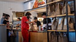Customers order food at a Chipotle Mexican Grill restaurant on April 26, 2023 in Austin, Texas.