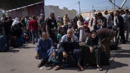 Palestinians wait to cross into Egypt at the Rafah border crossing in the Gaza Strip on Monday, Oct.16, 2023. As desperate Palestinians in sealed-off Gaza try to find refuge under Israel's relentless bombardment in retaliation for Hamas' brutal Oct. 7 attack, neighboring Egypt and Jordan have replied with staunch refusal, and they have multiple reasons for rejecting the idea. (AP Photo/Fatima Shbair, File)