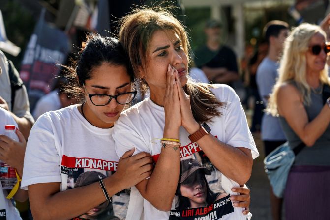 Women grieve at an event for the families of Israelis who are missing or being held hostage in Tel Aviv, Israel, on October 20. 