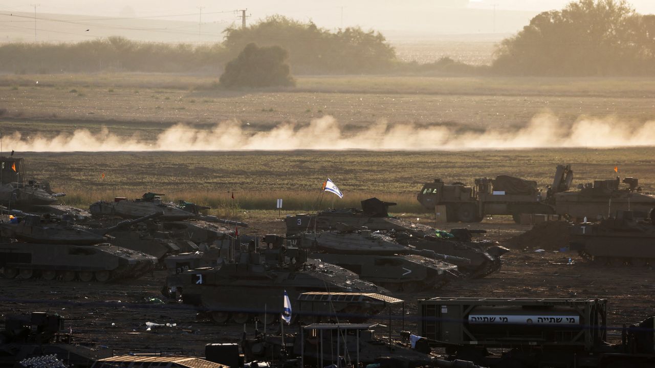 A formation of Israeli tanks and other military is positioned near Israel's border with the Gaza Strip, in southern Israel October 20, 2023.