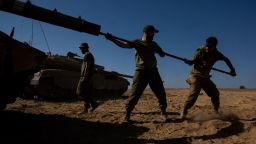 IDF soldiers clean the barrel of a tank in southern Israel on Saturday, October 21. Alexi J. Rosenfeld/Getty Images