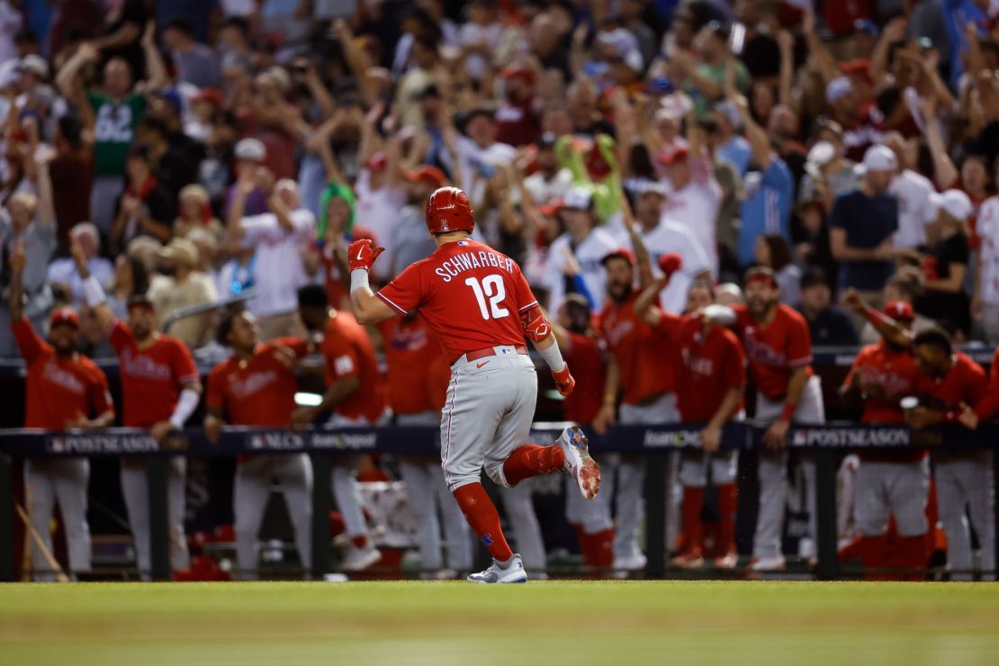 PHOENIX, AZ - OCTOBER 21:   Kyle Schwarber #12 of the Philadelphia Phillies reacts while rounding the bases after hitting a solo home run in the sixth inning during Game 5 of the NLCS between the Philadelphia Phillies and the Arizona Diamondbacks at Chase Field on Saturday, October 21, 2023 in Phoenix, Arizona. (Photo by Chris Coduto/MLB Photos via Getty Images)
