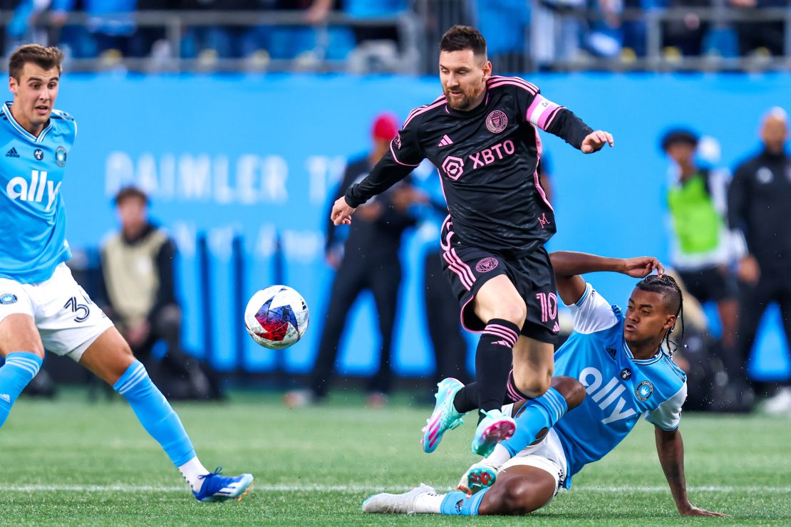 Lionel Messi #10 of Inter Miami jumps over Kerwin Vargas #18 of Charlotte FC during a soccer match at Bank of America Stadium in Charlotte, North Carolina on Oct 21, 2023.