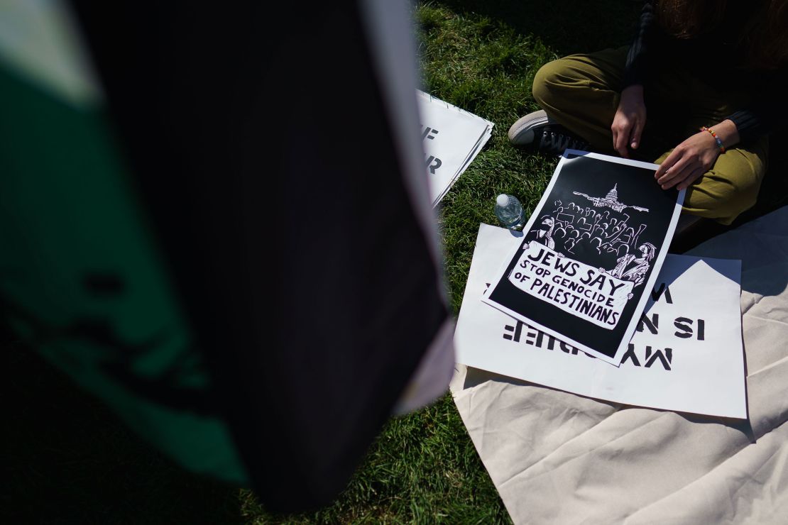 Jewish peace activists carried placards and handed out fliers denouncing Israeli airstrikes in Gaza.