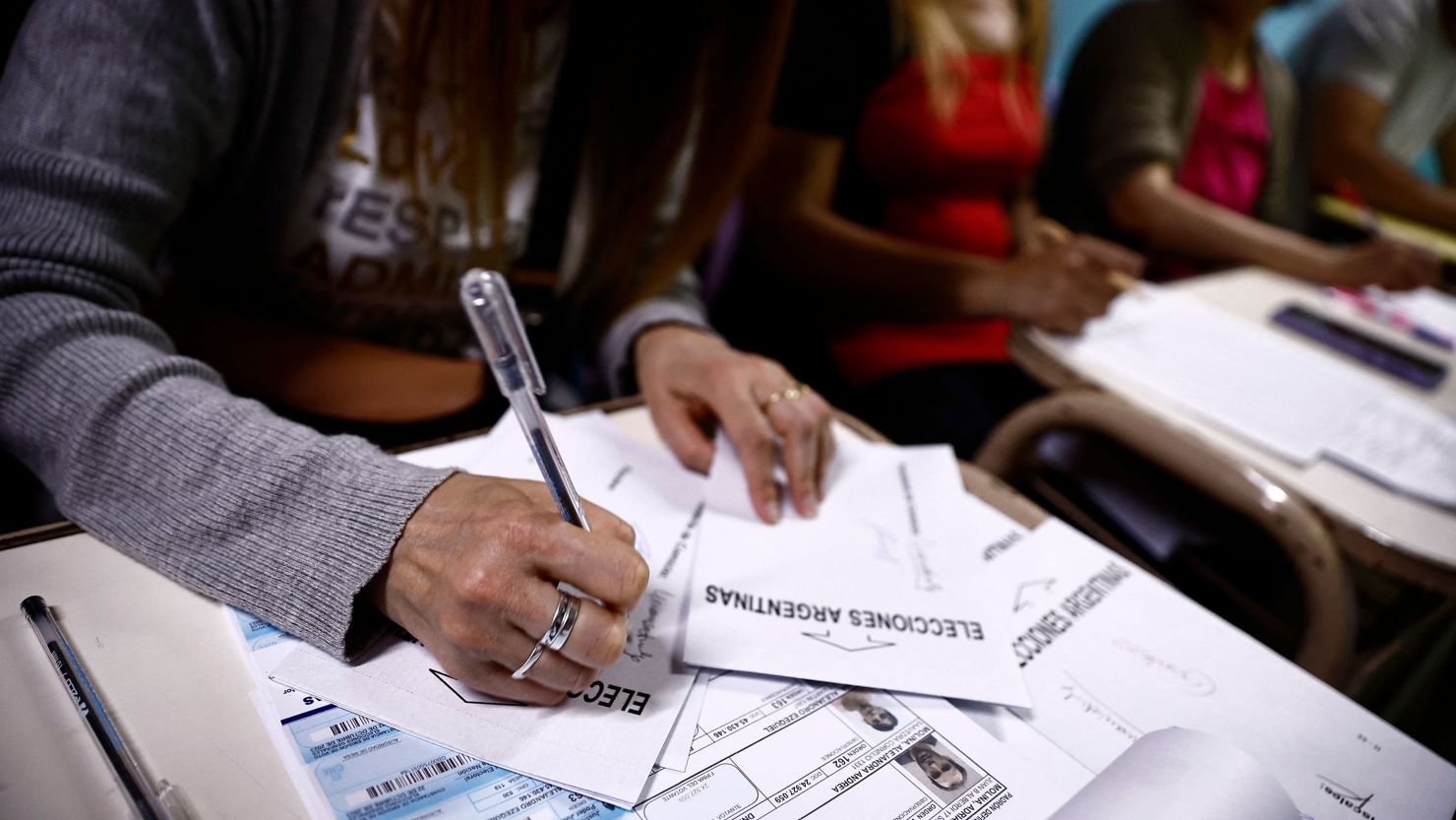 A polling station member works at a polling center in Tigre, Buenos Aires, during the Argentine presidential election on October 22, 2023. 