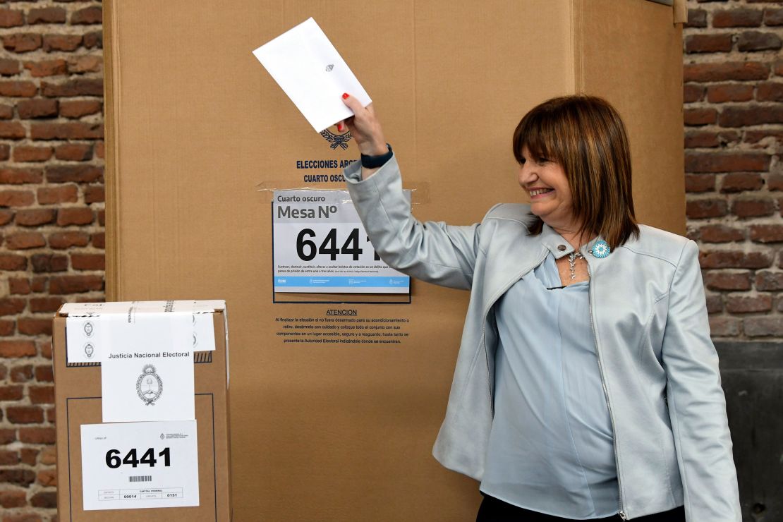  Bullrich holds up her marked ballot before putting it into the ballot box during primary elections in Buenos Aires, Argentina, Sunday, Oct. 22, 2023.