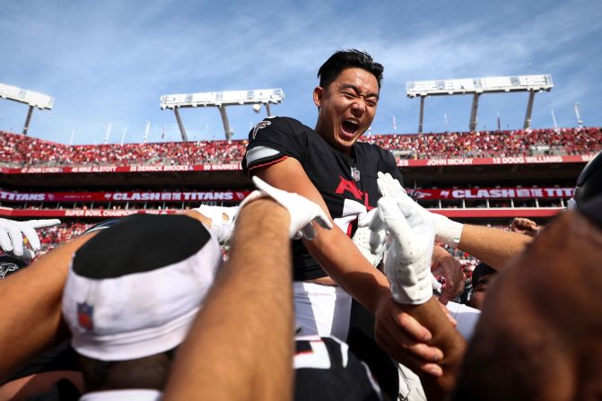 Atlanta Falcons placekicker Younghoe Koo celebrates with teammates after making a game-winning field goal on the final play of the Falcons' 16-13 victory over the Tampa Bay Buccaneers on October 22. 