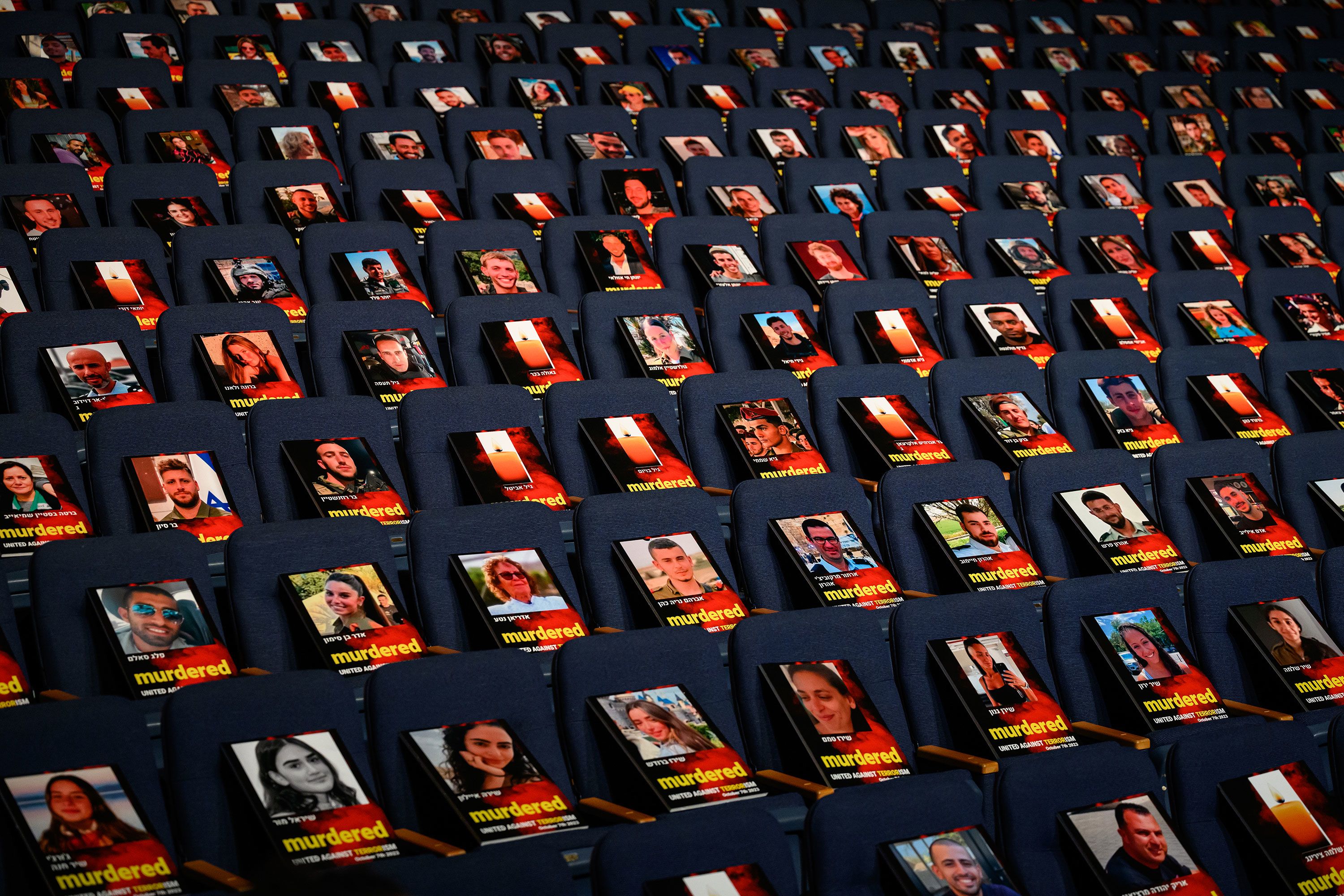Pictures of over 1,000 people abducted, missing or killed in the Hamas attack are displayed on empty seats in the Smolarz Auditorium at Tel Aviv University in Tel Aviv, Israel, on October 22.