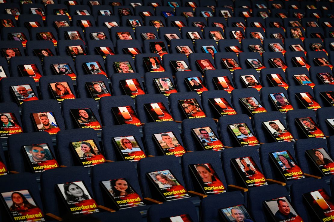 Pictures of over 1,000 people abducted, missing or killed in the Hamas attack are displayed on empty seats in the Smolarz Auditorium at Tel Aviv University in Tel Aviv, Israel, on Sunday.