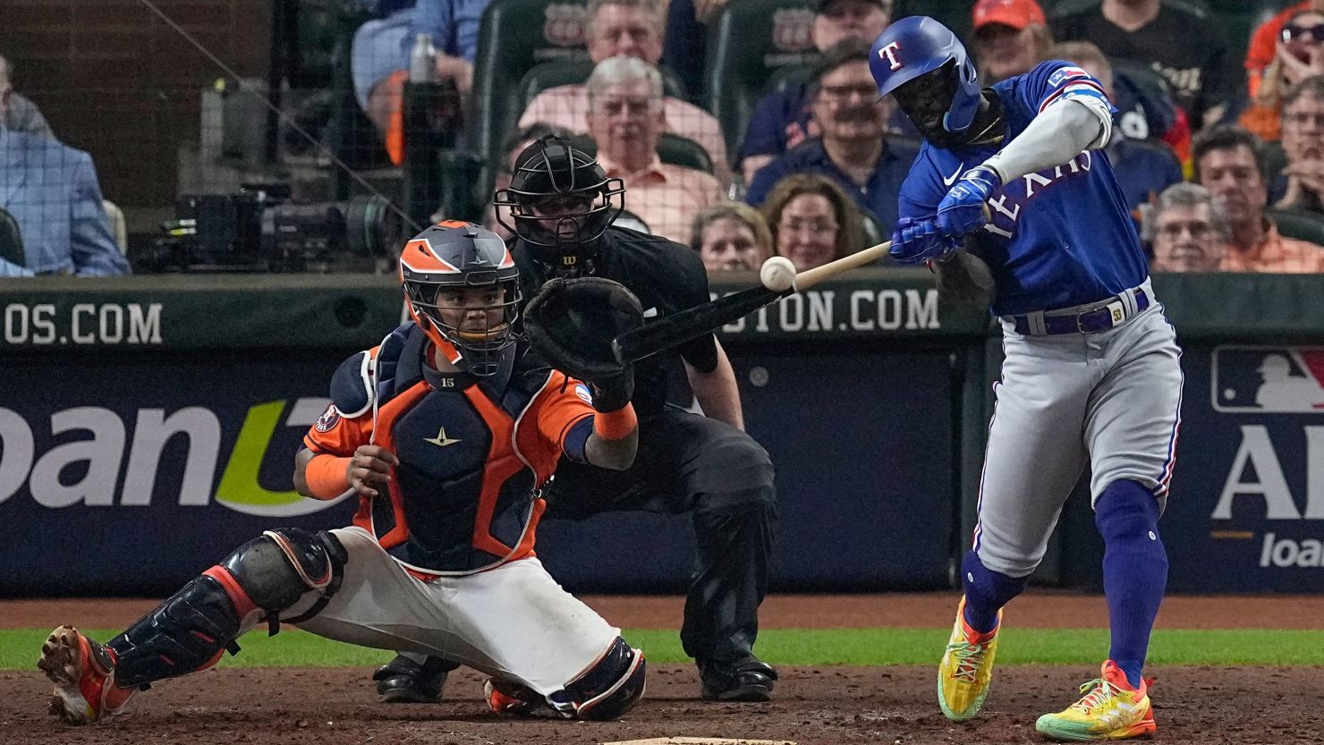 Texas Rangers' Adolis Garcia hits a grand slam during the ninth inning of Game 6 of the baseball AL Championship Series against the Houston Astros Sunday, Oct. 22, 2023, in Houston. (AP Photo/Tony Gutierrez)