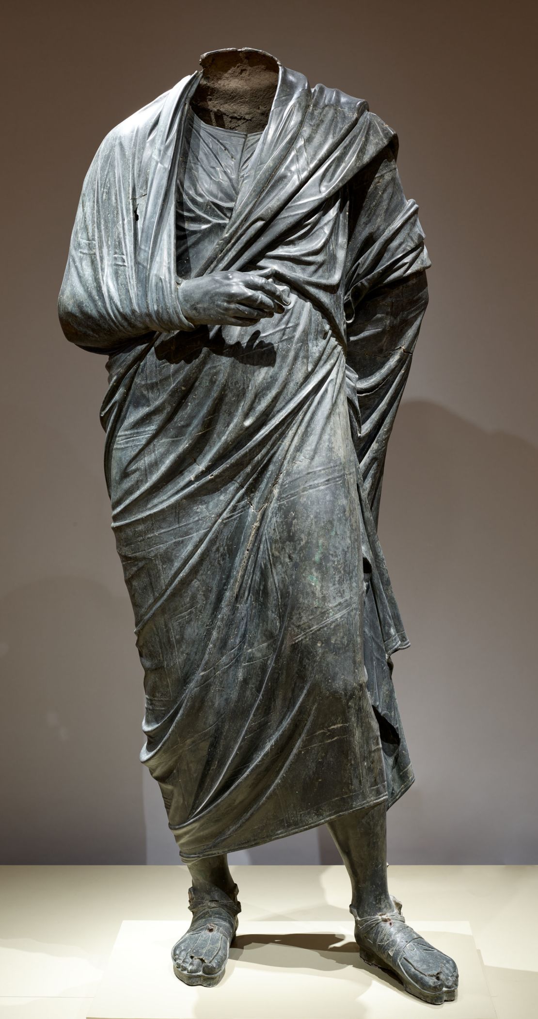 Draped Male Figure, c. 150 BCE--200 CE. Roman or possibly Greek Hellenistic. Bronze, hollow cast in several pieces and joined; overall: 193 cm (76 in.). The Cleveland Museum of Art, Leonard C. Hanna, Jr. Fund 1986.5