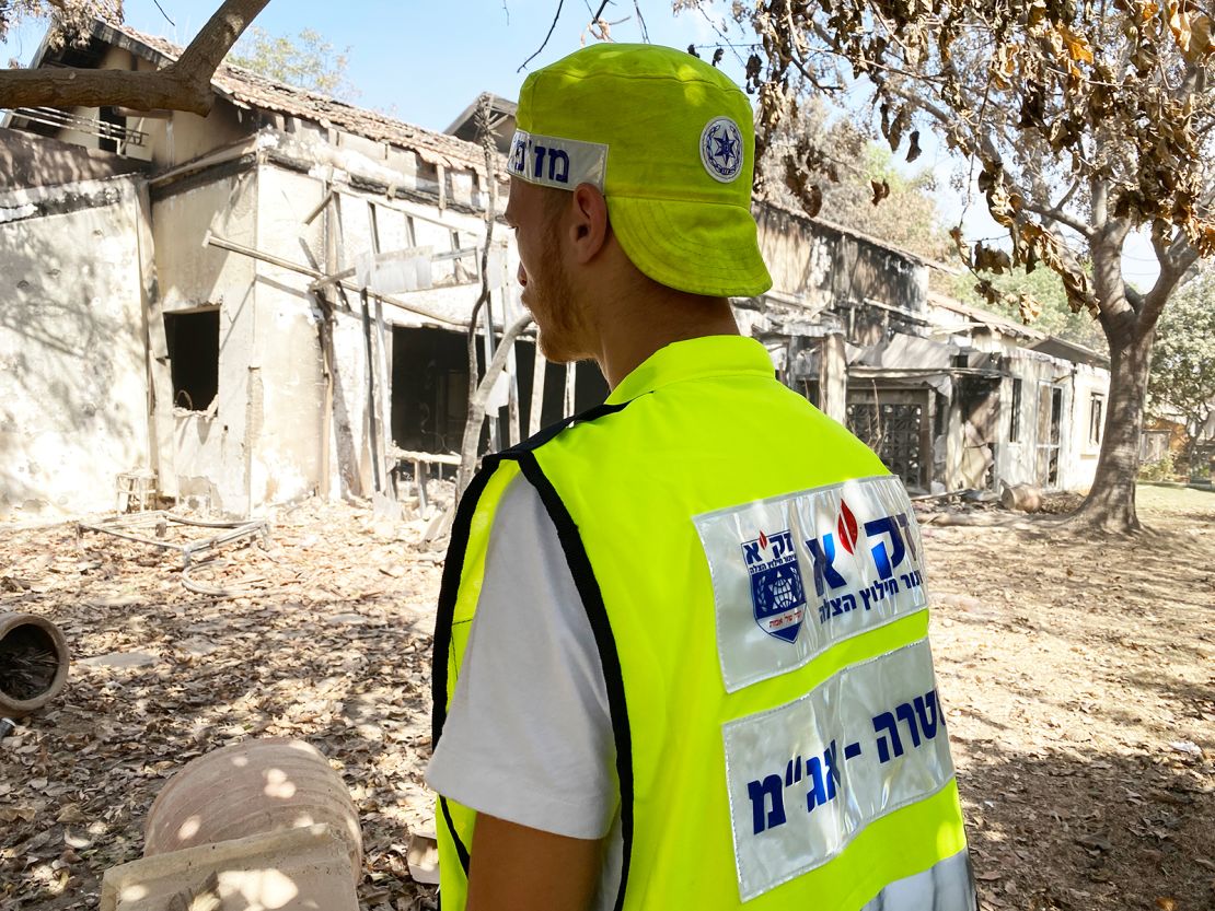 Eli Landau looks towards a house destroyed by Hamas in Be'eri on October 20, 2023.