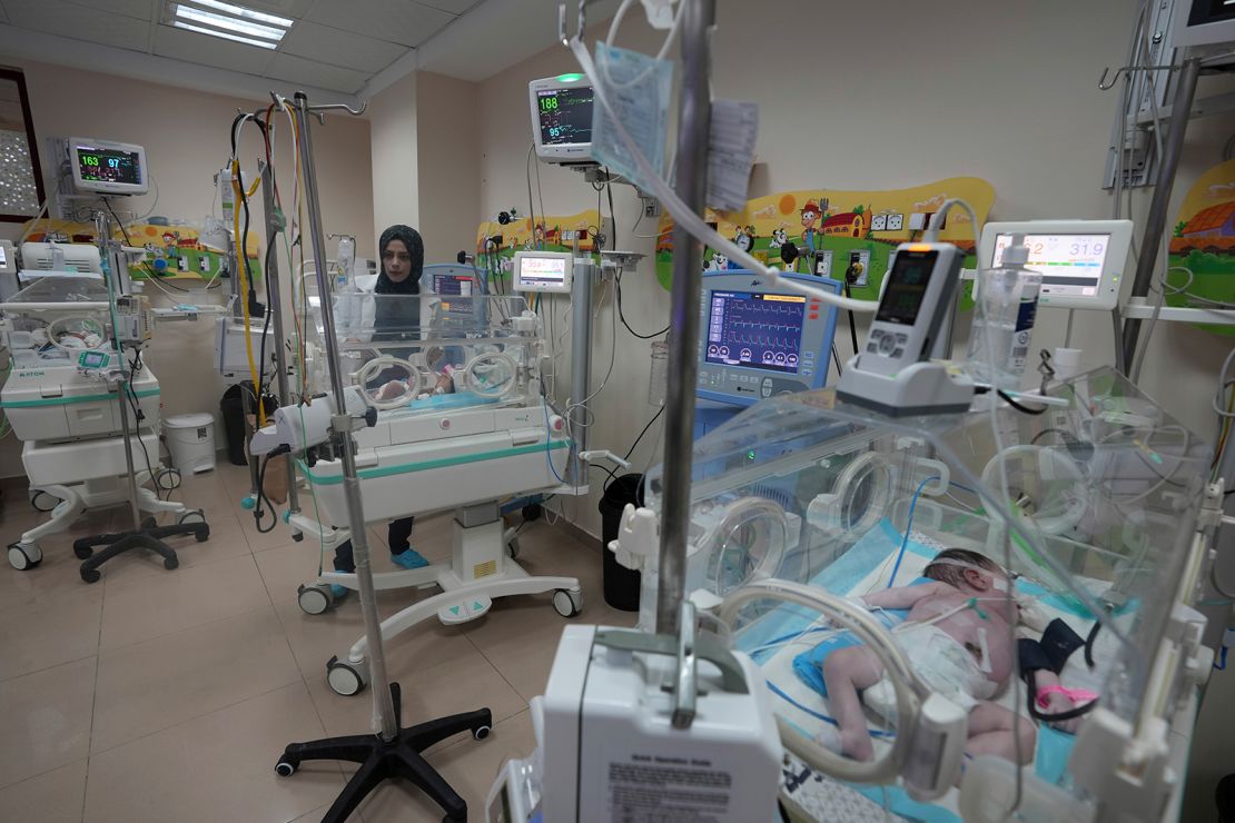 A Palestinian doctor treats a prematurely born baby at Al Aqsa Hospital in Deir el-Balah, Gaza, on October 22, 2023.