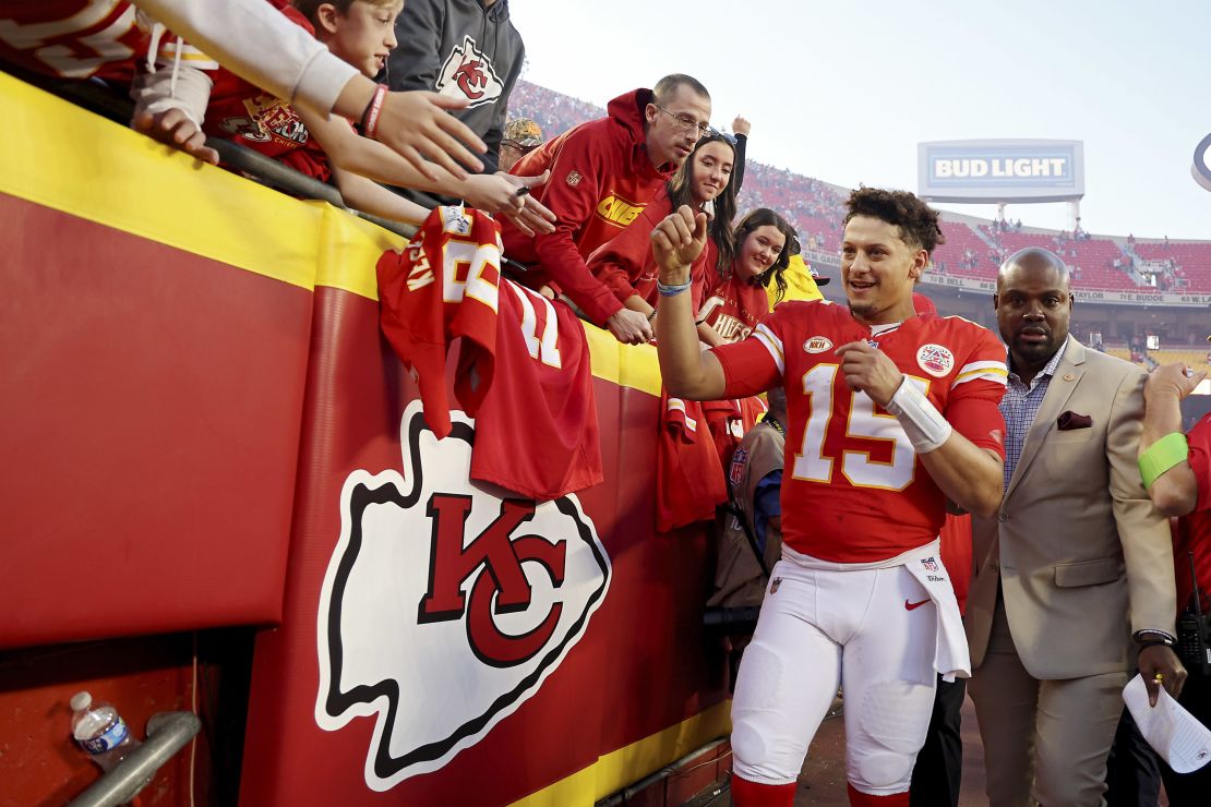 KANSAS CITY, MISSOURI - OCTOBER 22: Patrick Mahomes #15 of the Kansas City Chiefs high fives fans as he leaves the field after the game against the Los Angeles Chargers at GEHA Field at Arrowhead Stadium on October 22, 2023 in Kansas City, Missouri. (Photo by Jamie Squire/Getty Images)