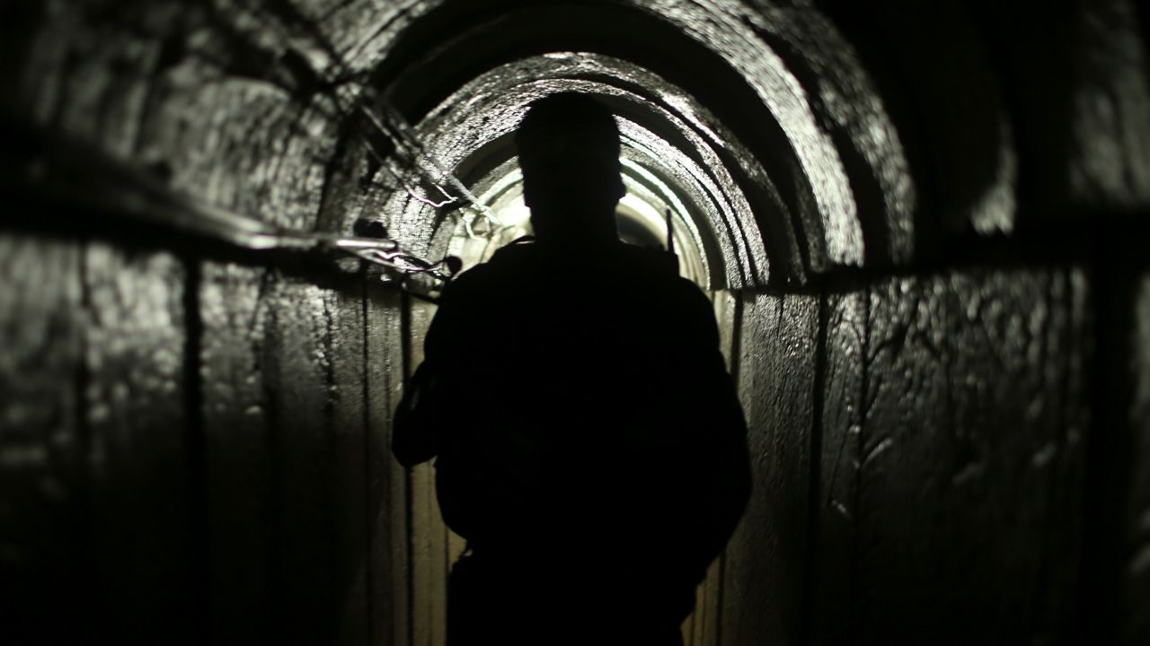 In this 2014 file photo, a fighter from the armed wing of the Hamas movement is seen inside an underground tunnel in Gaza.