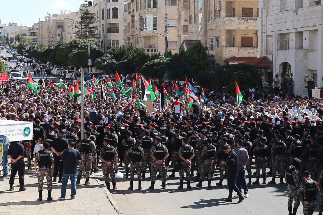 Pro-Palestine demonstrators chant slogans near the Israeli Embassy in Amman, on Friday.
