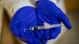 CVS MinuteClinic family nurse practitioner Kafayat Ayodele  holds a Flucelvax Quadrivalent influenza vaccine at CVS MinuteClinic, Wednesday, Sept. 22, 2021, in Houston. (Photo by Marie D. De Jesus/Houston Chronicle via Getty Images)