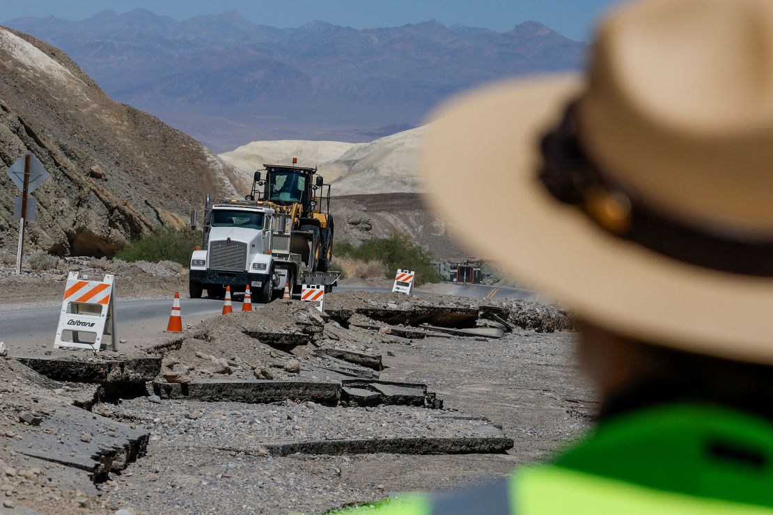 Road crews traverse along hwy 190 in Death Valley, California, on August 31, 2023, where most of the road was washed out. 