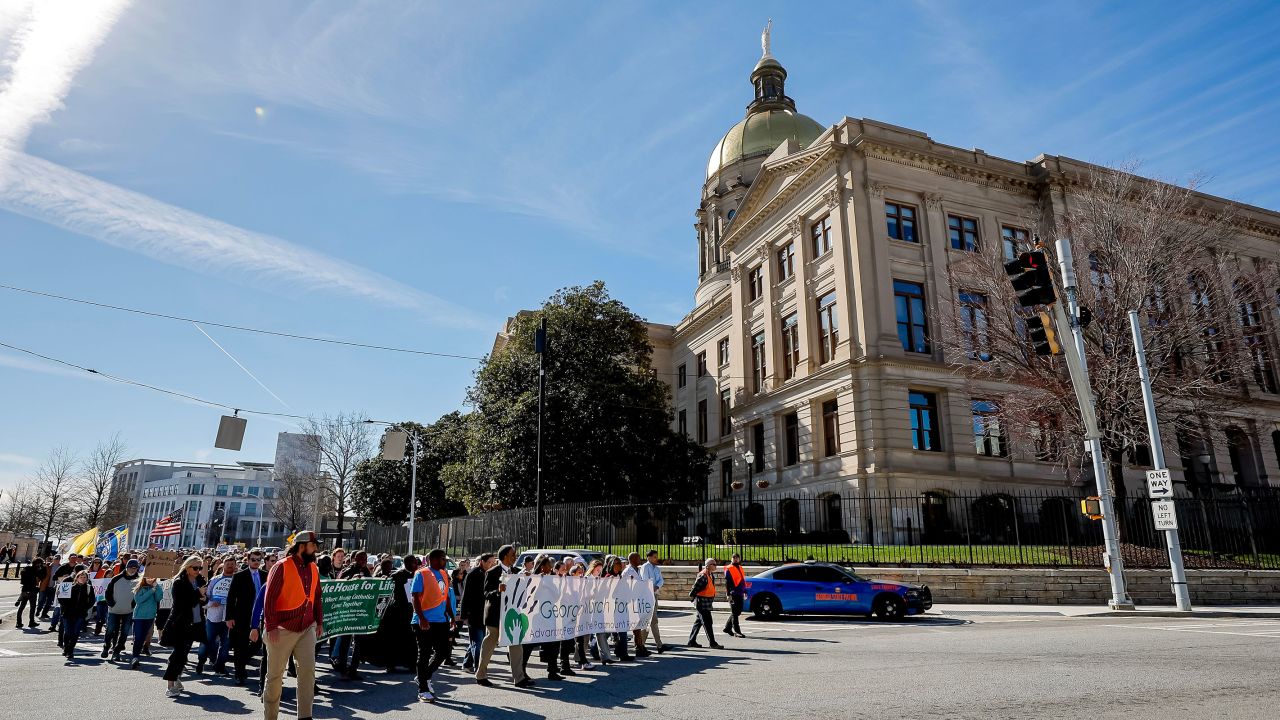 People walk past the Georgia State Capitol while participating in the Georgia March for Life & Memorial Service & Rally in downtown Atlanta, in January.