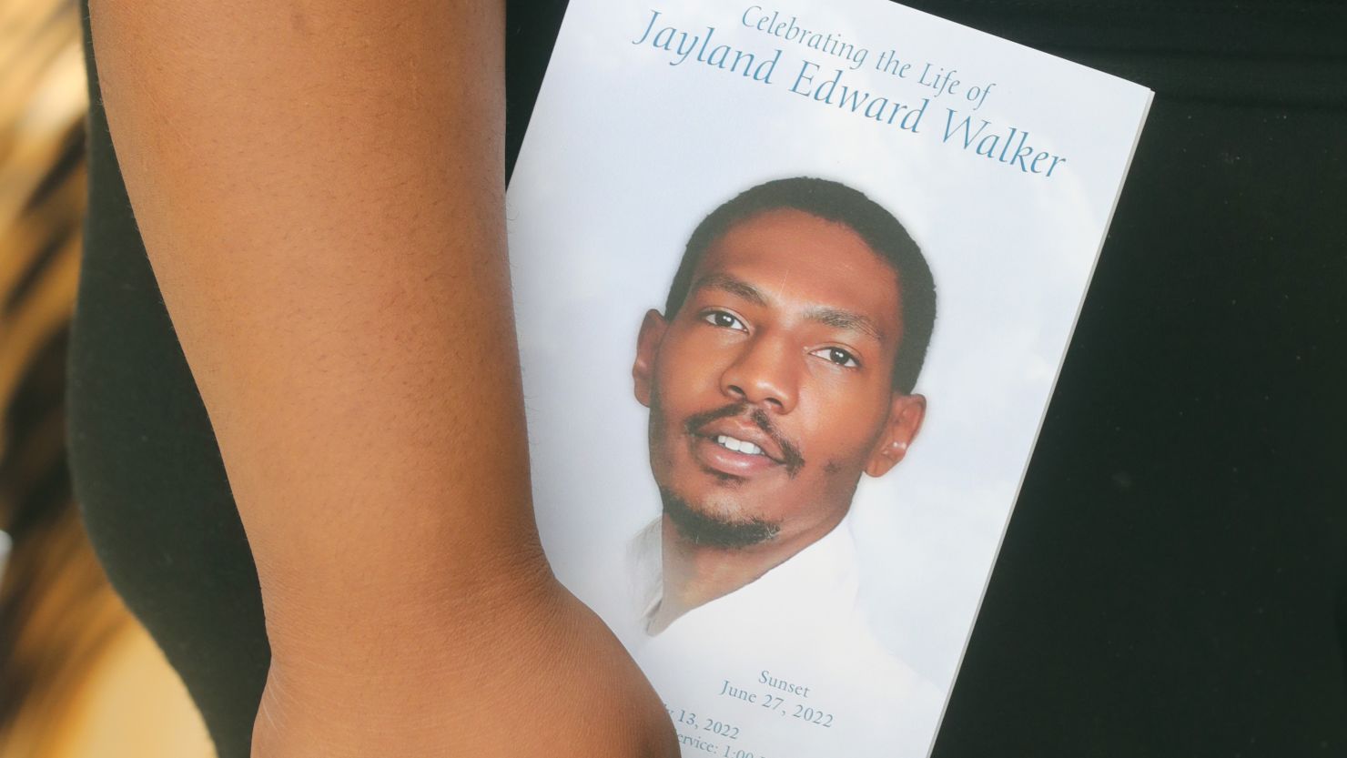 A mourner is seen at the funeral of Jayland Walker on Wednesday, July 13, 2022 in Akron, Ohio. The police officers involved in the shooting have been reinstated after no charges were filed against them.