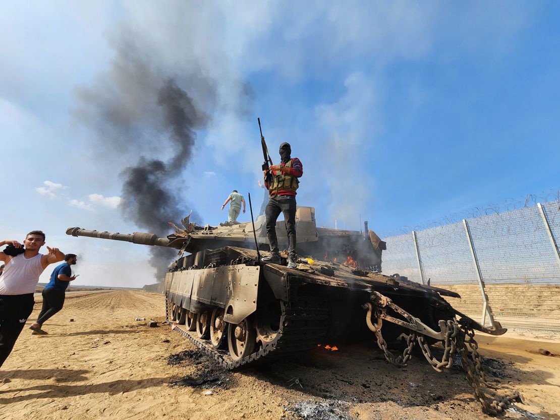 Hamas' armed wing, the Izz ad-Din al-Qassam Brigades destroy an Israeli forces' tank near Gaza City, Gaza on October 07.