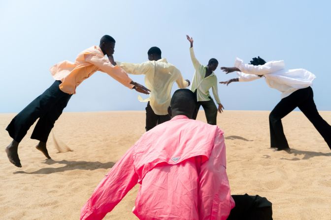 Togolese German photographer Delali Ayivi has become known for her striking images, including 'The Joy of it All,' which shows a group of people at a beach in Lomé, Togo. She says she is inspired by the work of her great-great-grandfather, who was one of the first Togolese photographers.