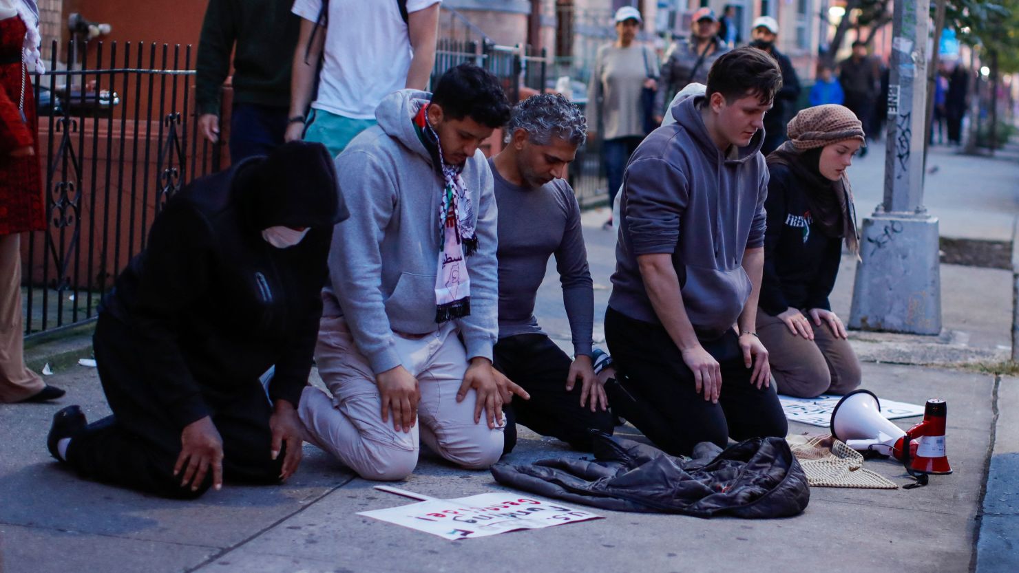 People pray during a rally in support of Palestinians in Brooklyn, New York, on October 21, 2023, amid ongoing conflict between Israel and Hamas.