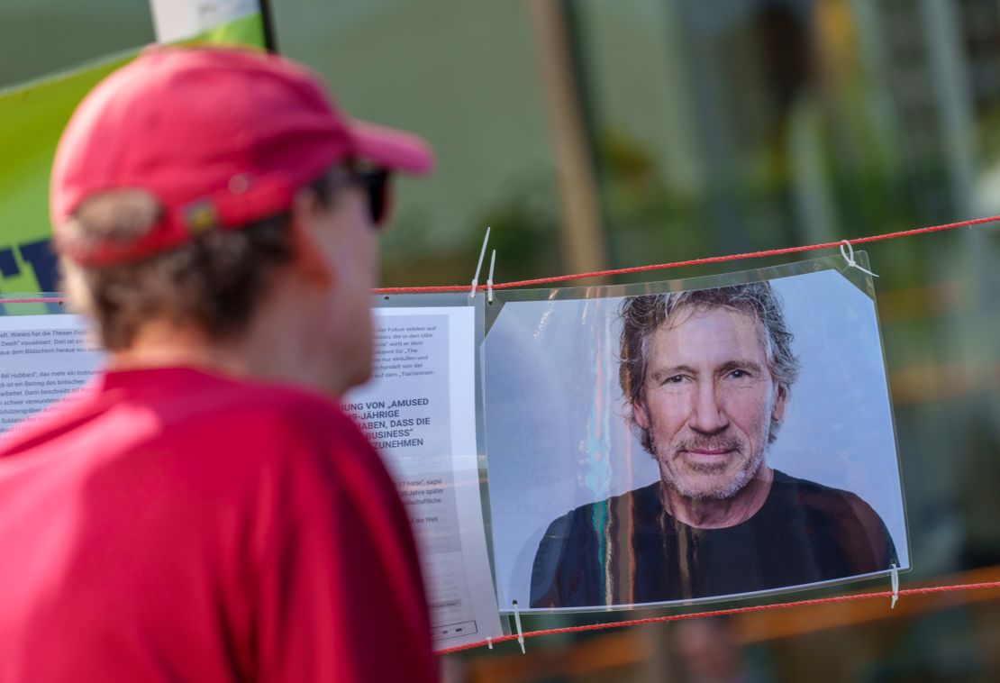 A man looks at the portrait of musician Roger Waters at a counter-event, which tries to present the singer's position, on the sidelines of a demonstration under the slogan "Frankfurt united against anti-Semitism". Waters is accused of using anti-Semitic tropes, which he denies. 