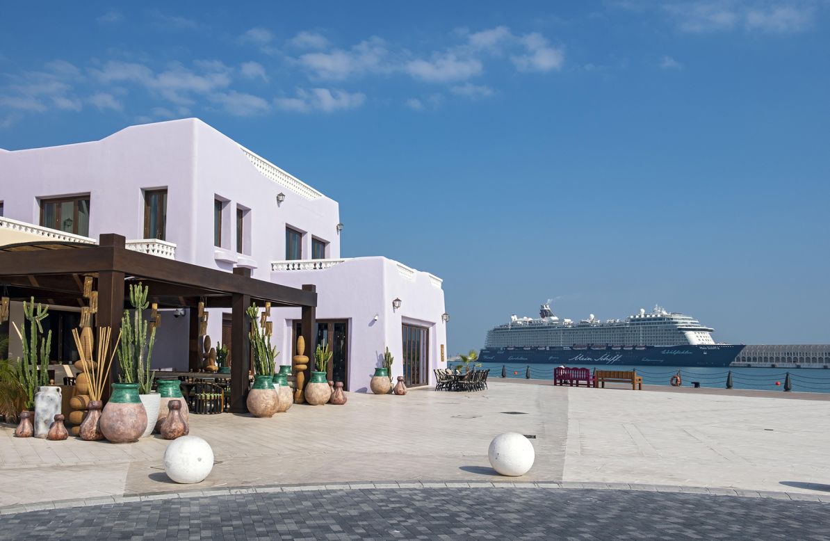 <strong>Taste of Greece:</strong> Next to the terminal sits the Mina District, a pastel-colored assortment of cafes, restaurants, and boutiques, all reminiscent of Greece. 