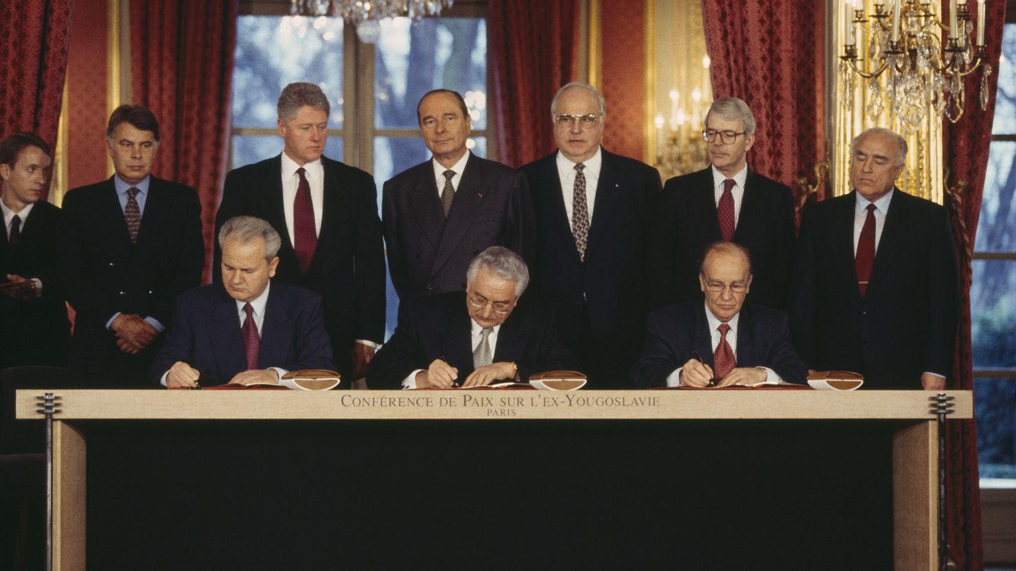 Serbian President Slobodan Milosevic, Croat President Franjo Tudjman, and Bosnian President Alija Izetbegovic sign the Dayton Peace Accord with six other heads of state, Felipe Gonzalez, Bill Clinton, Jacques Chirac, Helmut Kohl, John Major and Viktor Chernomyrdin. (Photo by Larry Downing/Sygma/Sygma via Getty Images)