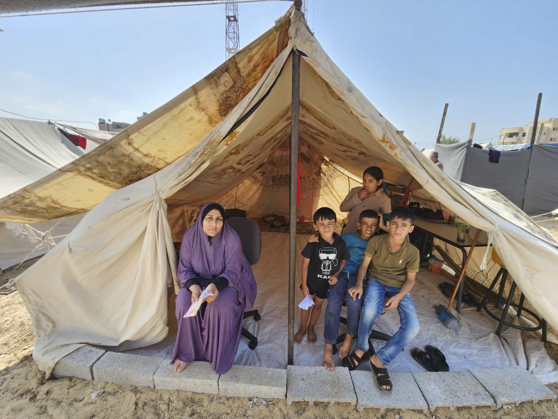 Taghrid Ebead, left, and her family were forced to flee al-Majdal. She is now sheltering in southern Gaza after being ordered to evacuate from her home in the north.