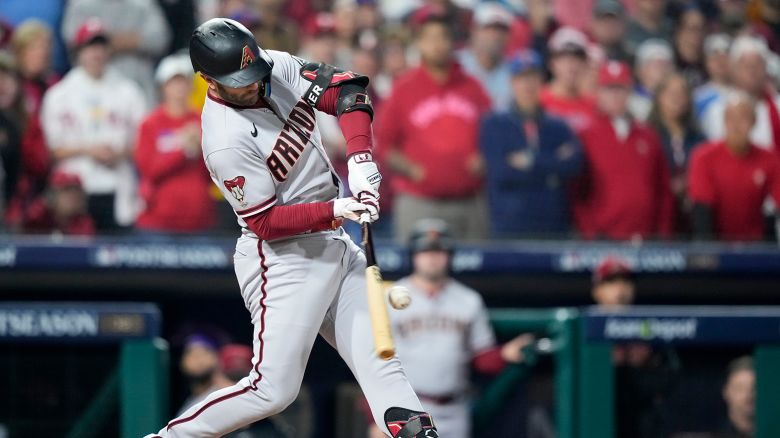 Arizona Diamondbacks' Christian Walker breaks his bat and scores a run on a fielder's choice against the Philadelphia Phillies during the first inning in Game 7 of the baseball NL Championship Series in Philadelphia Tuesday, October 24, 2023. 