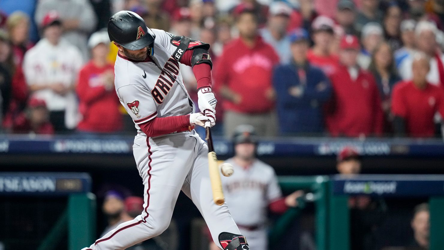 The Arizona Diamondbacks' Christian Walker breaks his bat and scores a run on a fielder's choice against the Philadelphia Phillies during the first inning on Tuesday.