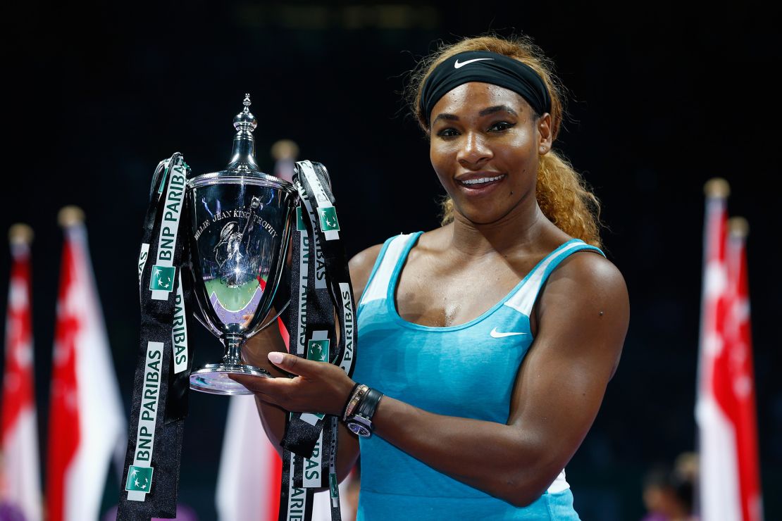 SINGAPORE - OCTOBER 26:  Serena Williams of USA celebrates with the Billie Jean King trophy after she defeats Simona Halep of Romania in the final during day seven of the BNP Paribas WTA Finals tennis at the Singapore Sports Hub on October 26, 2014 in Singapore.  (Photo by Julian Finney/Getty Images)