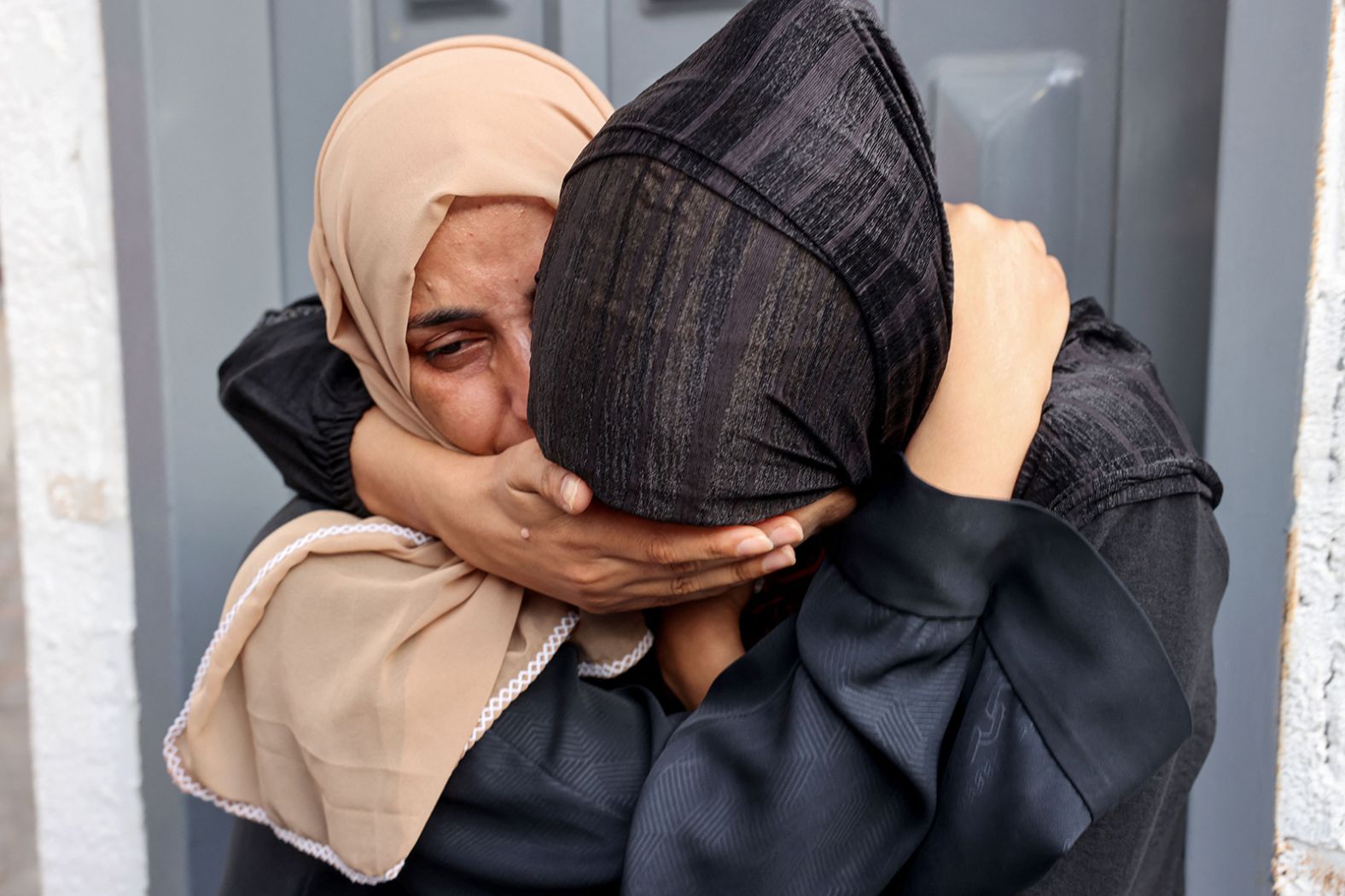 Palestinians mourn their loved ones killed in an Israeli strike, outside Najjar hospital in Rafah, Gaza, on October 24.