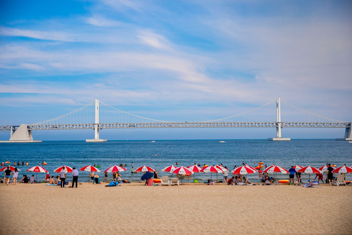 <strong>Gwangalli Beach:</strong> A happening strip of sand filled with cafes, bars and eateries, Gwangalli Beach looks out across the water to Busan's iconic Gwangan Diamond Bridge. 