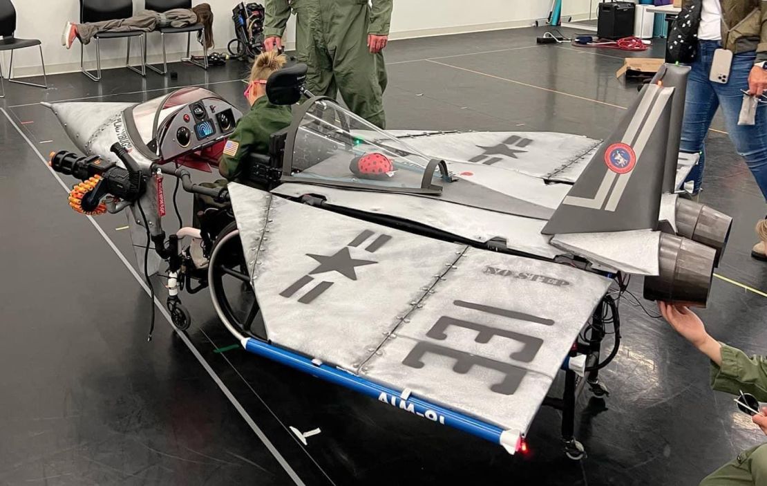 Through thoughtful design and special parts, even large costumes like this "Top Gun" fighter jet can fit through doorways. "We can still have these big costumes that look great, but if they're not functional for the families or for the kids, then we haven't done our job," Lon says.