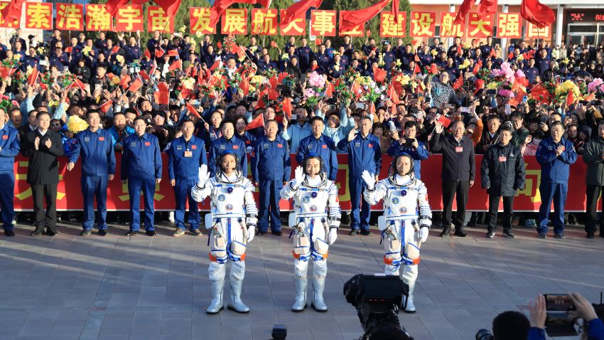 ALXA, CHINA - OCTOBER 26: (L-R) Chinese astronauts Jiang Xinlin, Tang Shengjie and Tang Hongbo, who will carry out the Shenzhou-17 spaceflight mission, attend a see-off ceremony at the Jiuquan Satellite Launch Center on October 26, 2023 in Alxa League, Inner Mongolia Autonomous Region of China. (Photo by VCG/VCG via Getty Images)