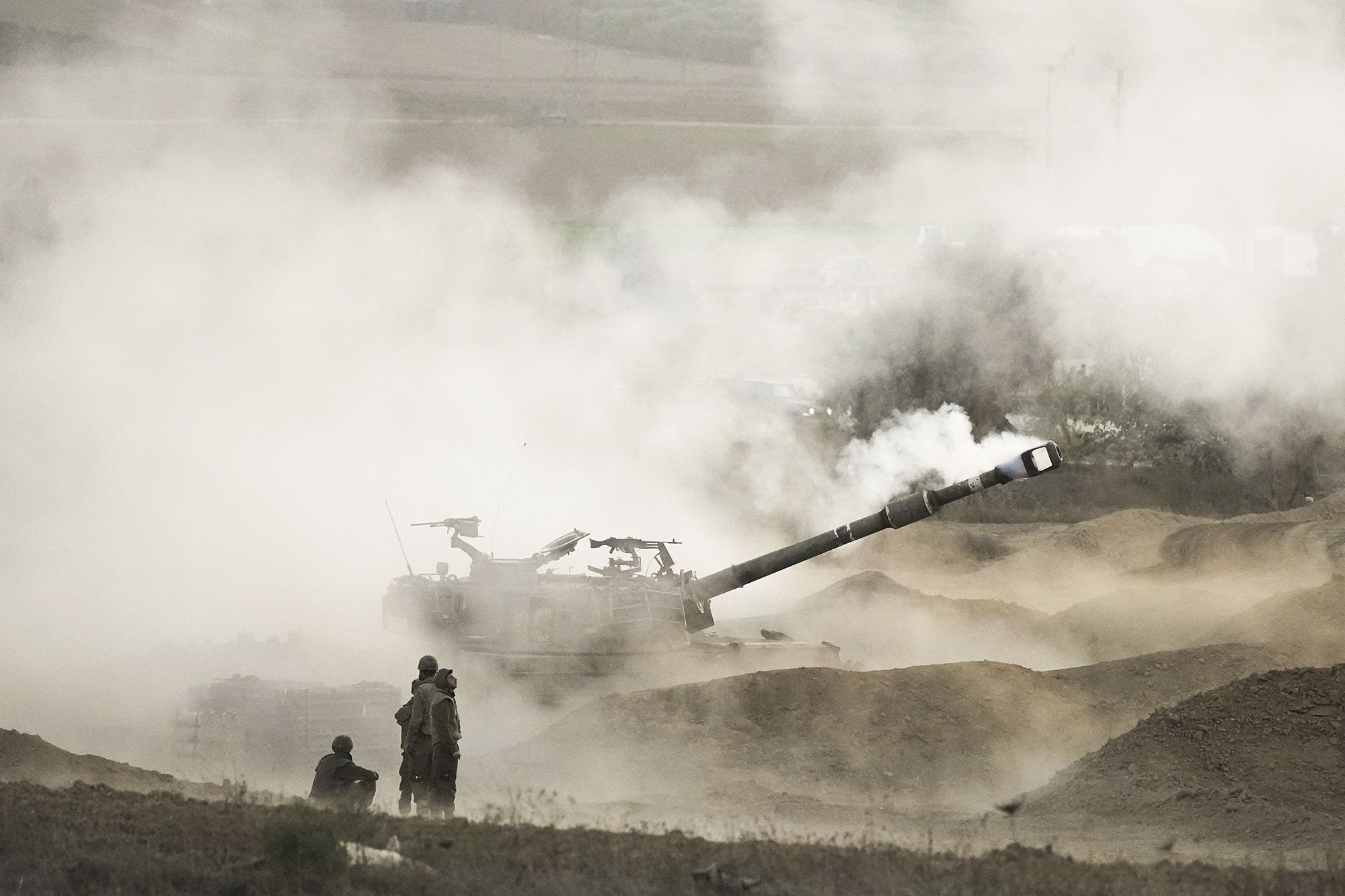 An Israeli mobile artillery unit fires a shell from southern Israel towards Gaza on October 25.<br /> 
