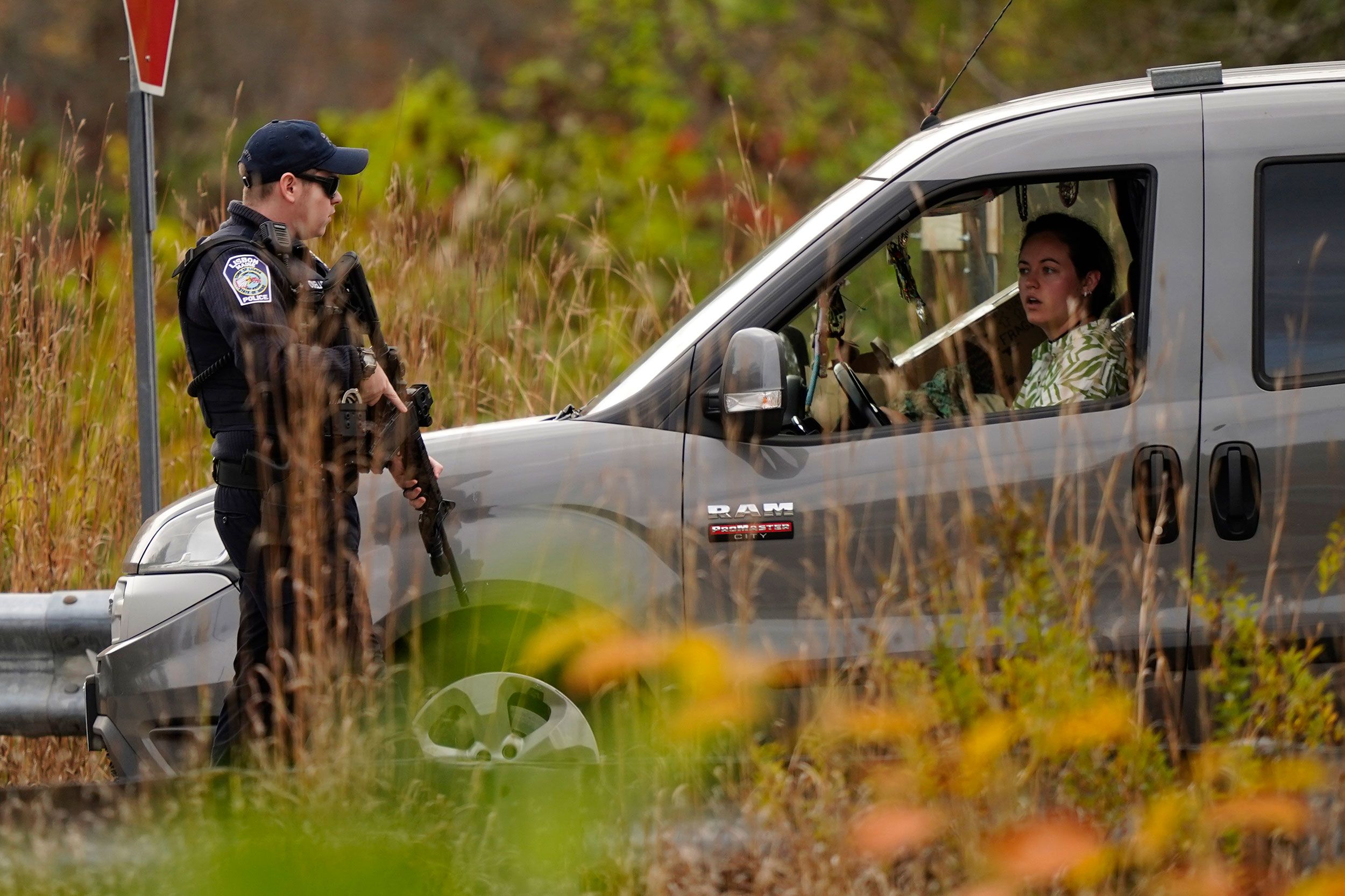 A police officer speaks to a driver at a roadblock in Lisbon on Thursday.