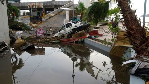 FILE - A street is strewn with debris after Hurricane Otis ripped through Acapulco, Mexico, Wednesday, Oct. 25, 2023. Hurricane Otis turned from mild to monster in record time, and scientists are struggling to figure out how — and why they didn't see it coming. (AP Photo/Marco Ugarte, File)